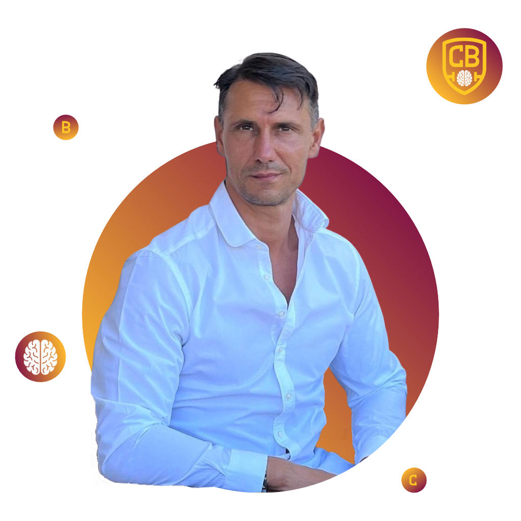 Claudio Brassini, coach strategico e personal trainer, ritratto in camicia bianca mentre guarda verso l’obiettivo.